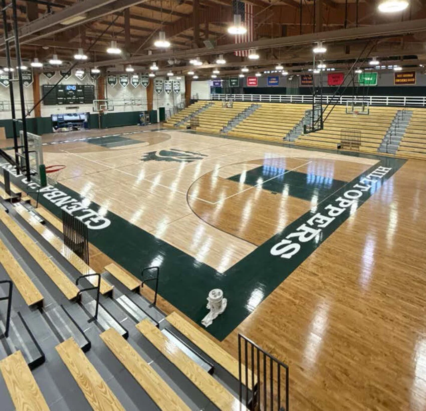 Photo of completed Biester Gym bleacher installation and floor refinishing at Glenbard West