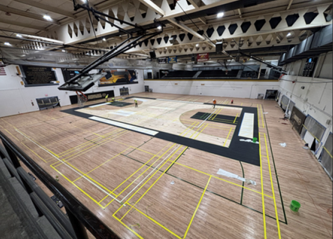 Construction picture of gym sanding at Glenbard North