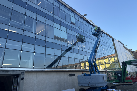 Photo of Glenbard East windows with crane in foreground